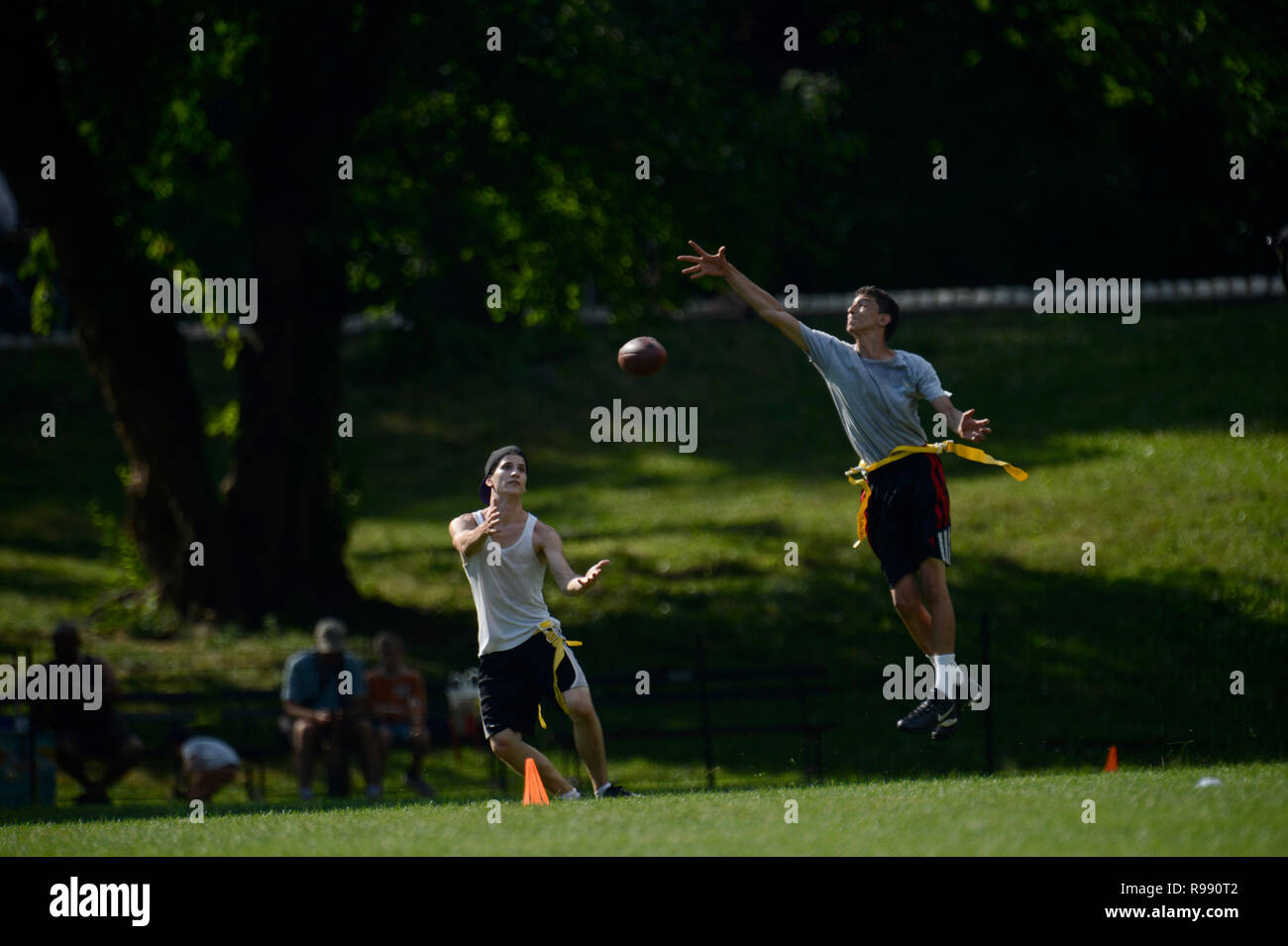 boys playing touch football in Central Park in New York City Stock Photo
