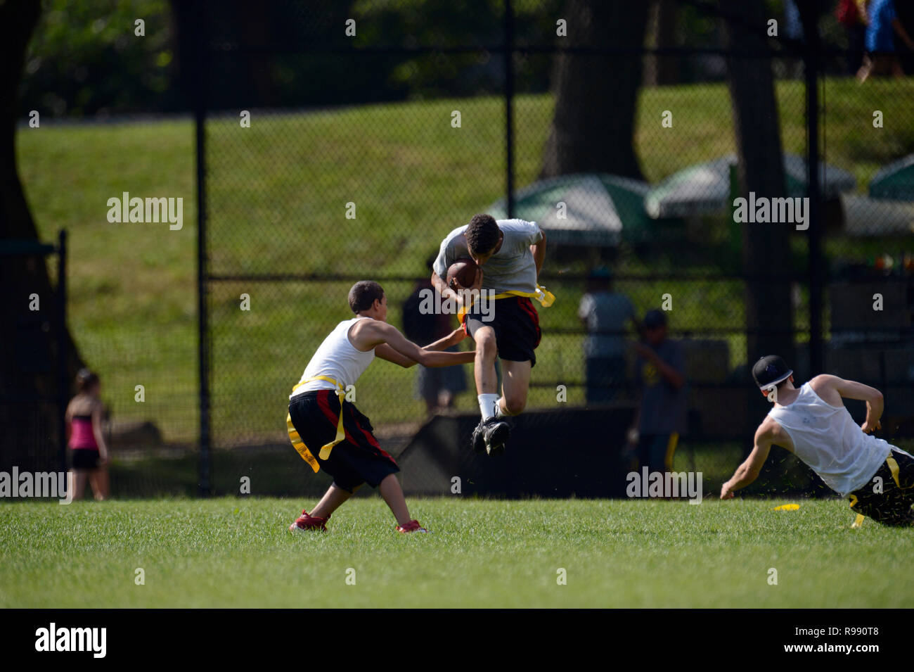 boys playing touch football in Central Park in New York City Stock Photo