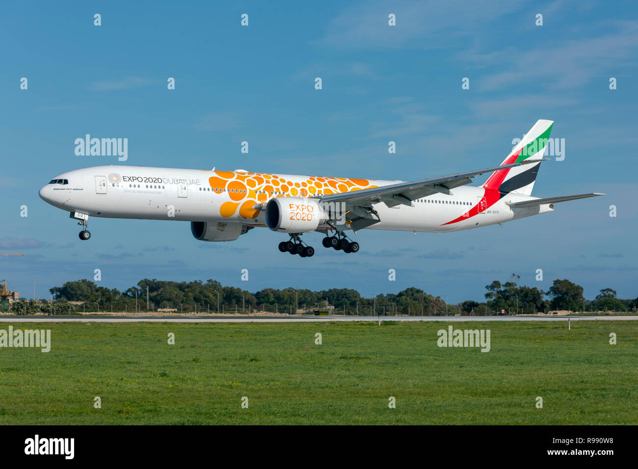 Emirates Boeing 777-31H/ER (REG: A6-ECU) with special Expo 2020 logo landing runway 31. Stock Photo