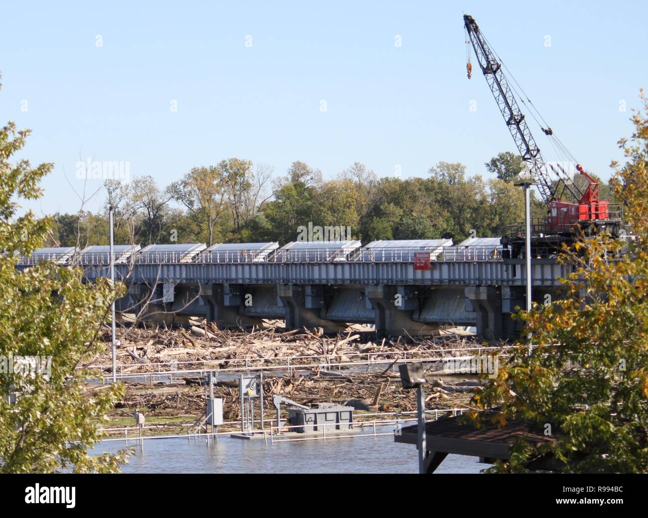 A debris field covers as far as the eye can see upstream of the dam at