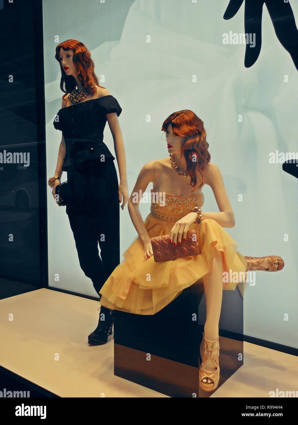 Two stylish mannequins in a window display Stock Photo