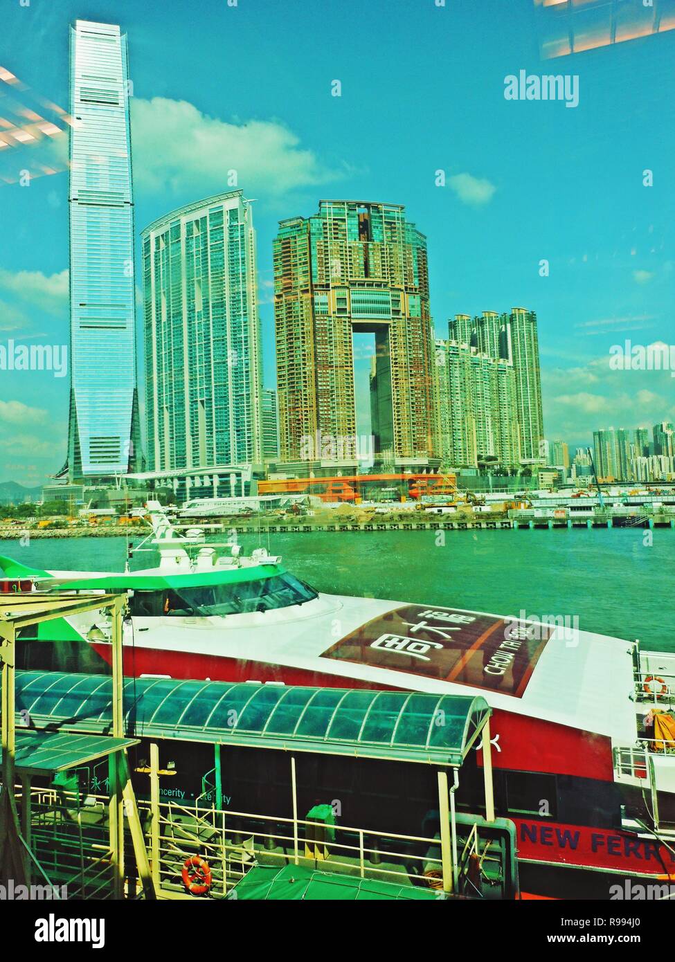 Hong Kong Ferry Overlooking ICC Tower and Elements Stock Photo