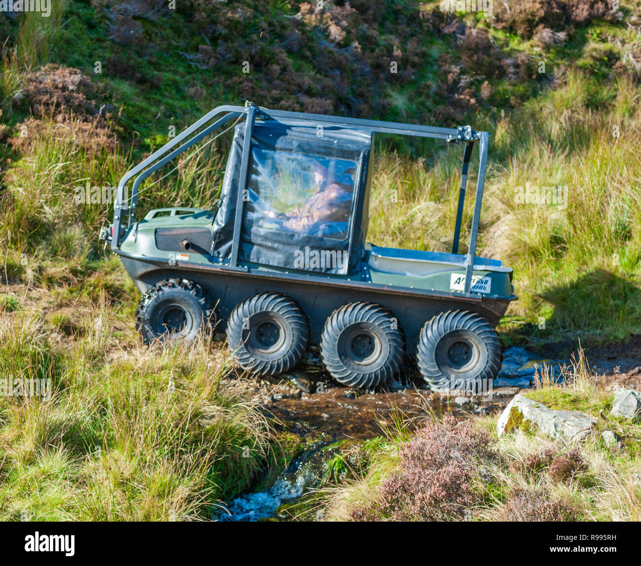 An Argocat multiwheel allterrain vehicle working high in The Scottish