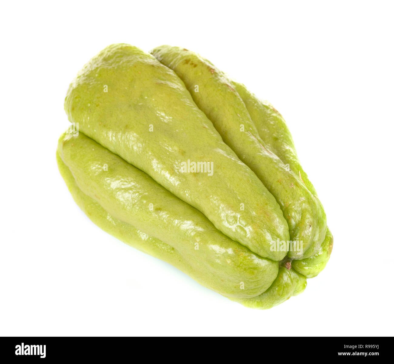 mirliton squash in front of white background Stock Photo - Alamy