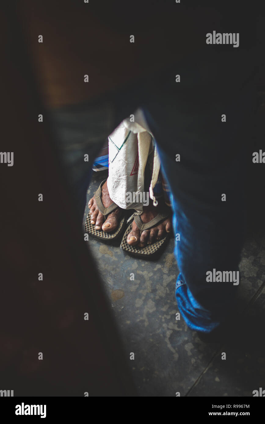 Feet of local mature man wearing sandals, Sri Lanka Stock Photo