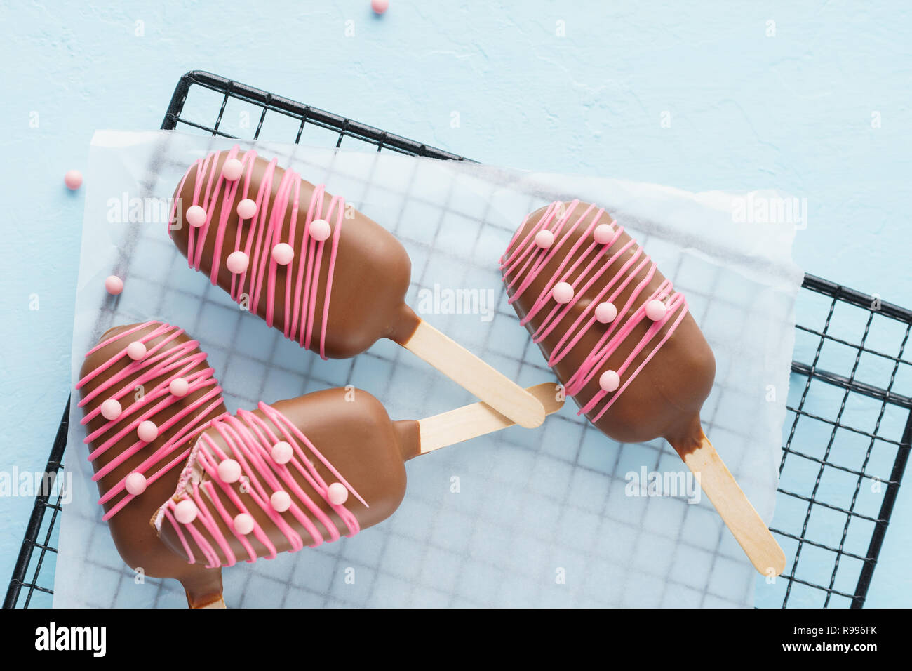 Chocolate covered ice cream on stick. Sweets for Valentine's day Stock