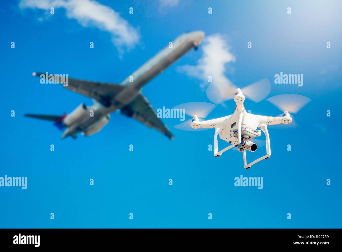 drone fly close to the commercial airplane near the airport Stock Photo