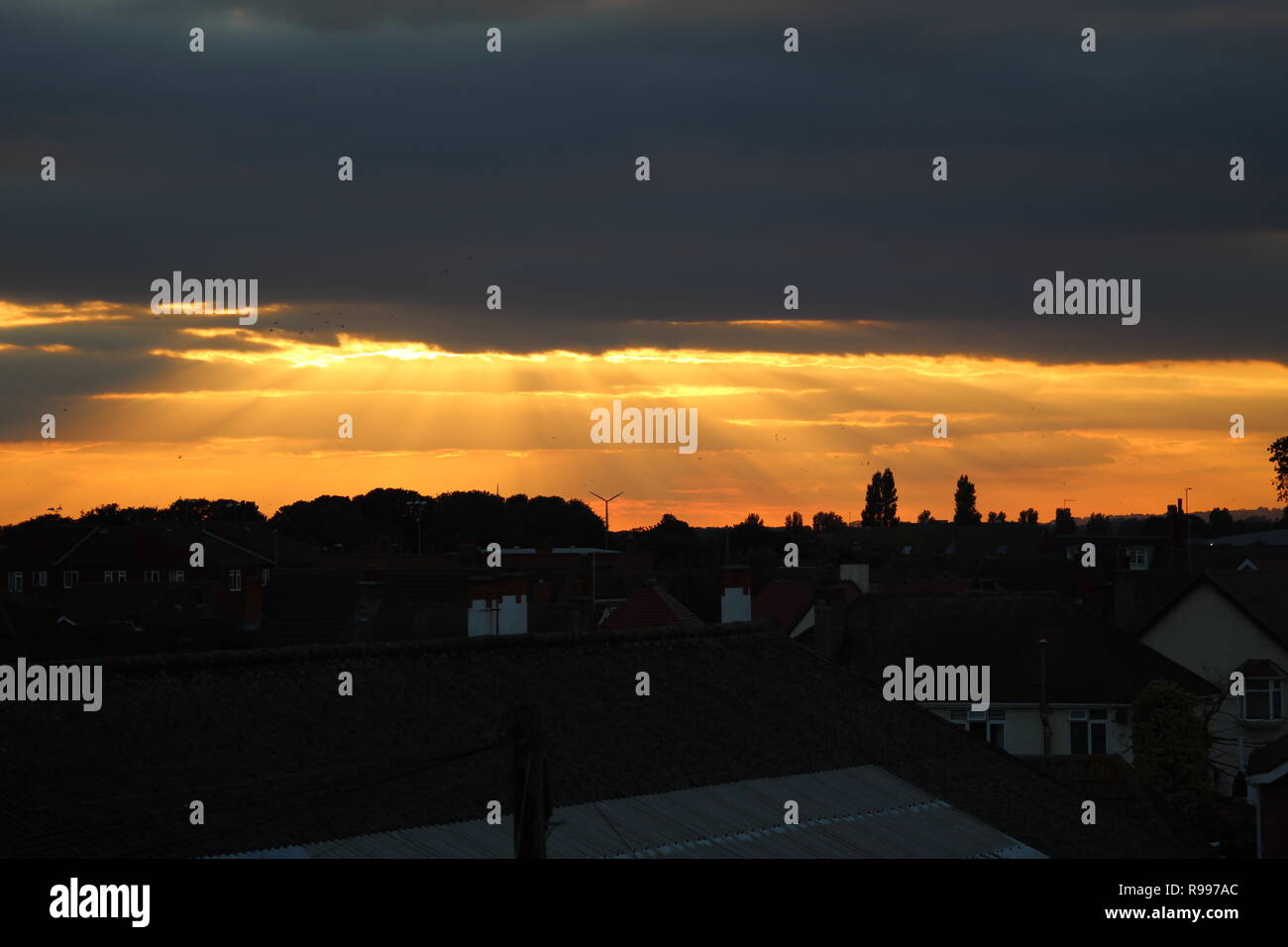 suns rays shining down over skegness through the clouds Stock Photo