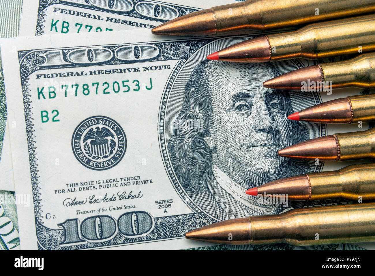 on the banknotes of dollars are fighting bullets closeup. Concept of
