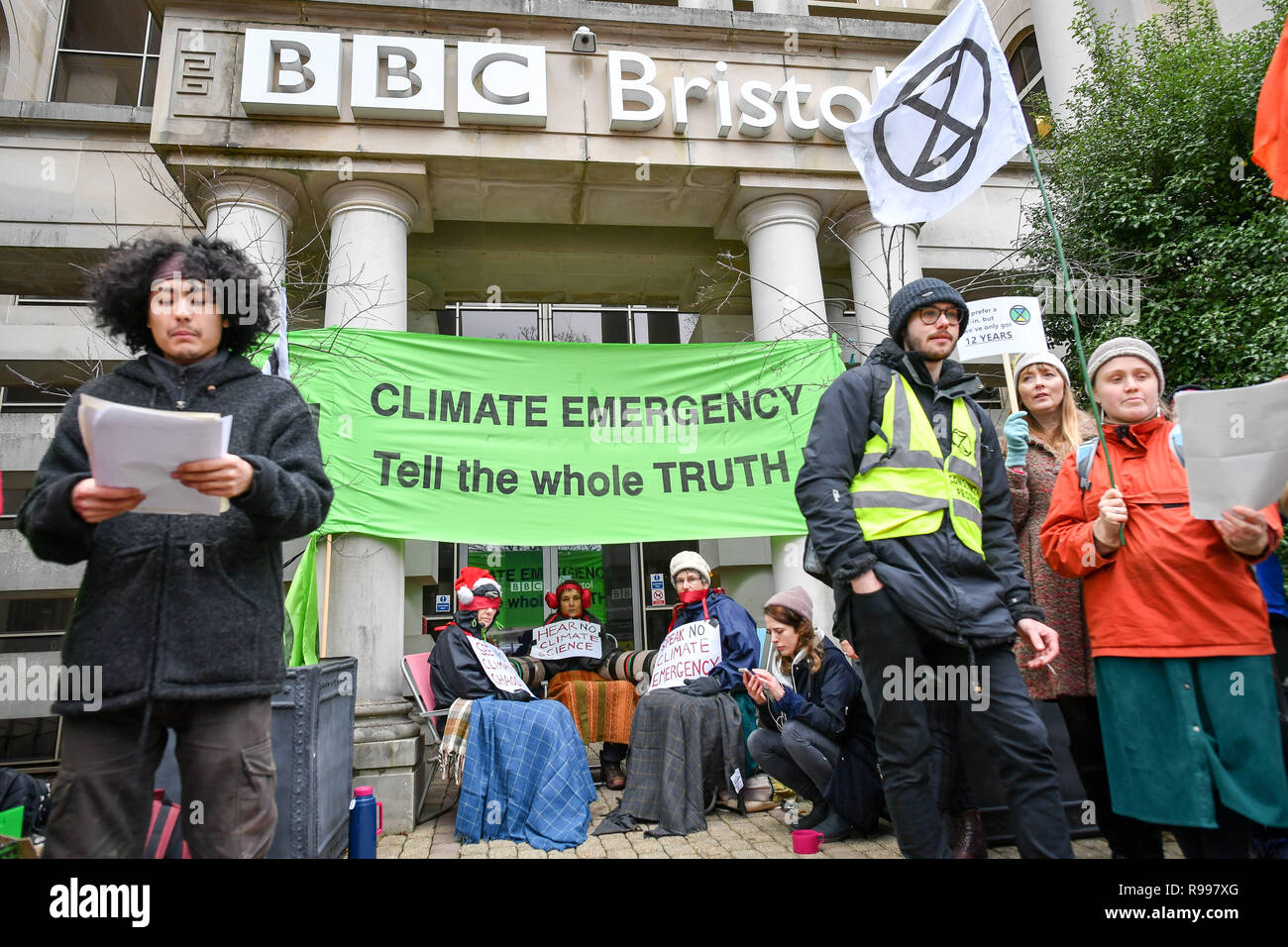 Climate change activists from Extinction Rebellion chain themselves together outside the BBC Bristol building on Whiteladies Road, Clifton, Bristol, during a peaceful protest against the way they think the broadcaster covers the 'climate emergency'. Stock Photo