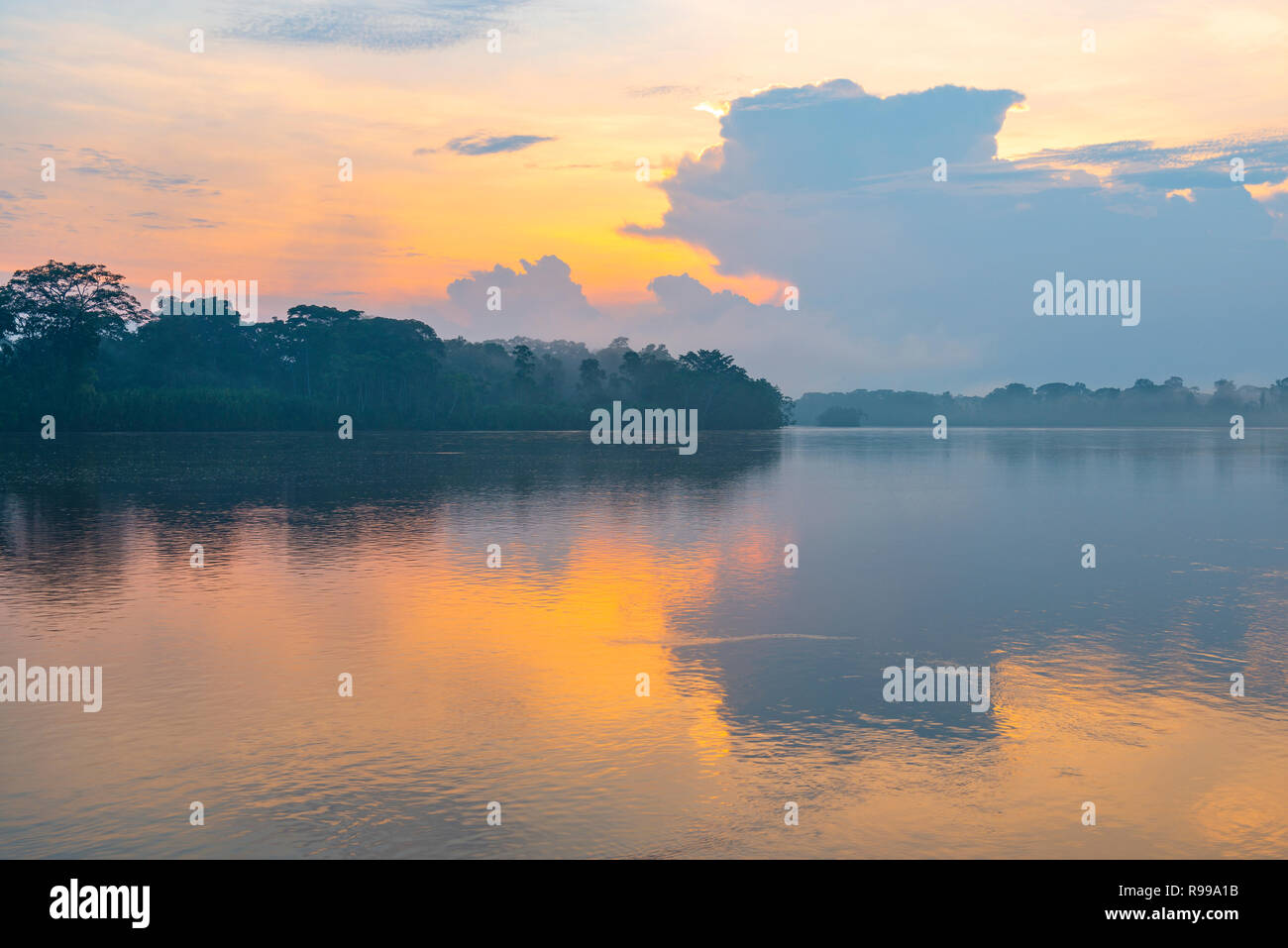 Landscape photograph of a sunset in the Amazon River Basin located in the counties of Bolivia, Ecuador, Colombia, Peru, Brazil, Venezuela and Guyana. Stock Photo