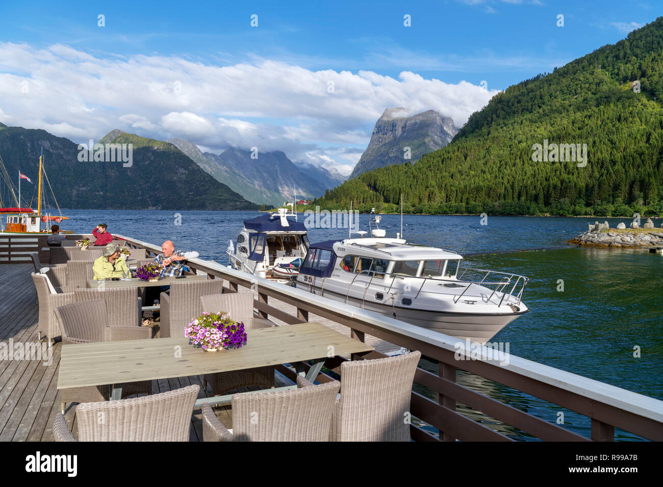 Guests sitting on the deck the Sagafjord Hotel bar in the late ...