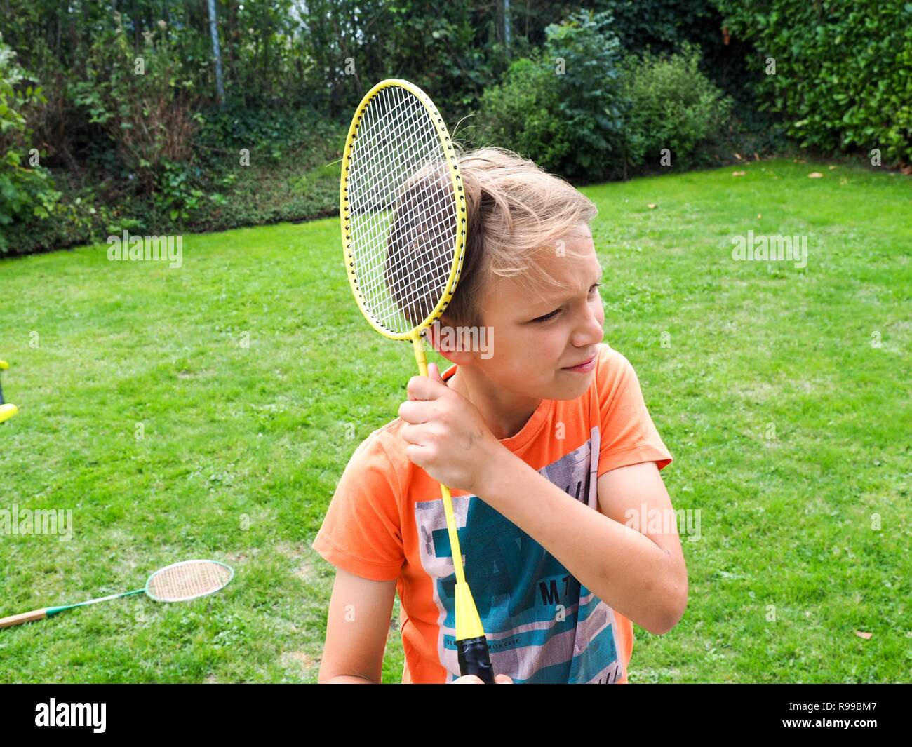 Boy playing badminton hi-res stock photography and images - Alamy