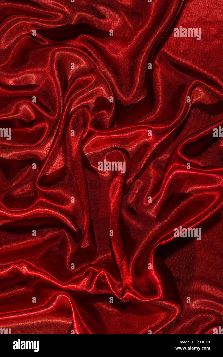 Background of red satin fabric. Shiny silk backdrop Stock Photo - Alamy