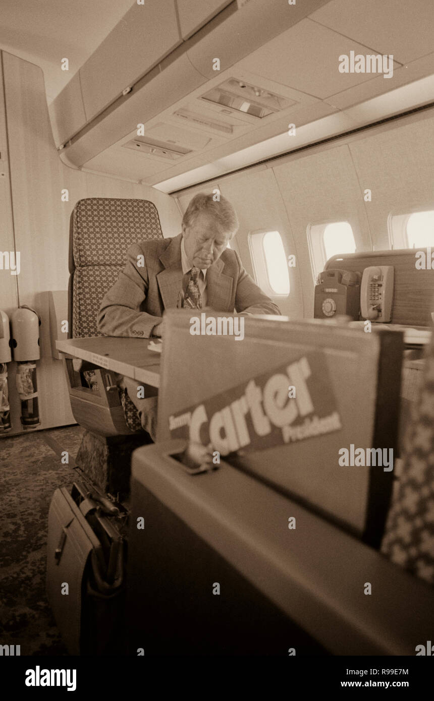 Jimmy Carter working aboard "Peanut One" campaign airplane. 1976 Sep