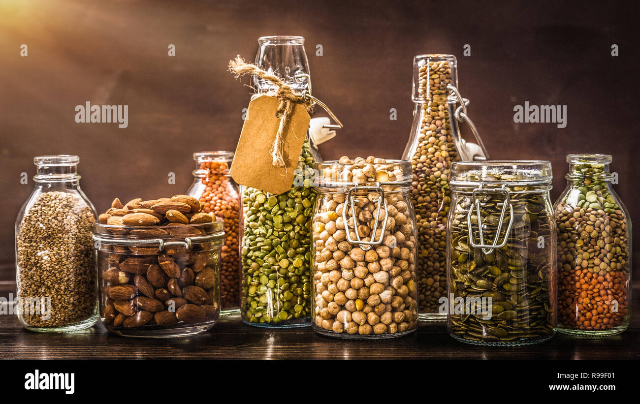 Various dry legumes,pumpkin seeds, almonds, in a glass jar Stock Photo Alamy