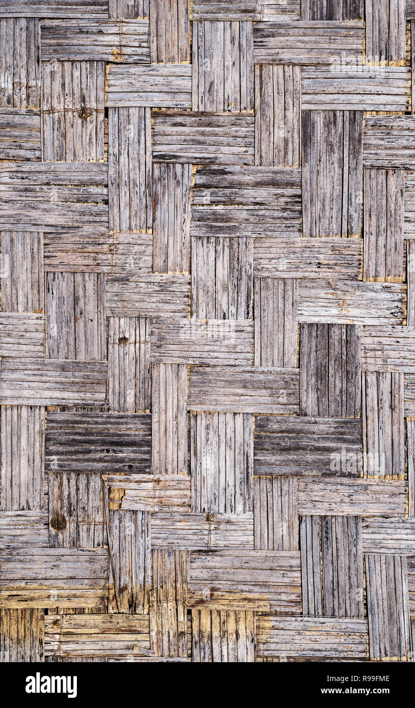 old gray distressed grunge bamboo mat background texture Stock Photo