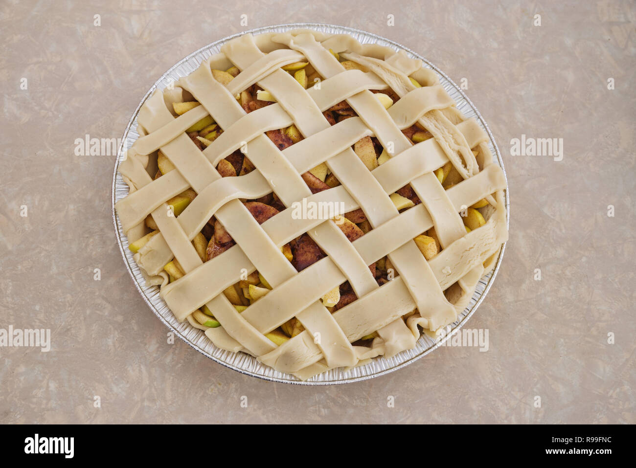 raw homemade apple pie with lattice crust ready to be baked Stock Photo