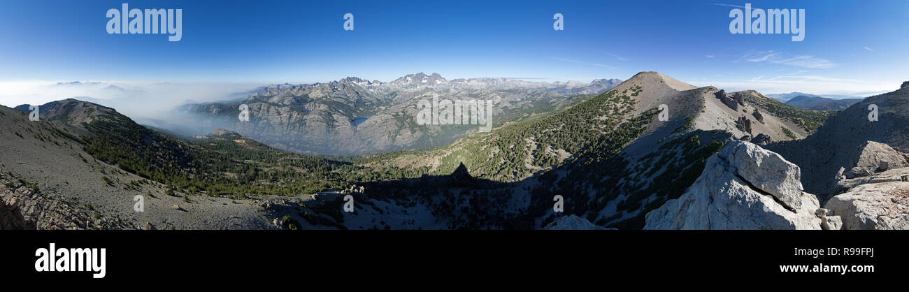 panorama from Two Teats Peak on San Joaquin Ridge with smoke from the Lions Fire to the south and the Minarets and Ritter and Banner Peaks Stock Photo