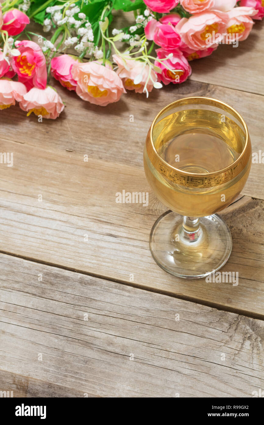 glass of white wine and flowers Stock Photo - Alamy