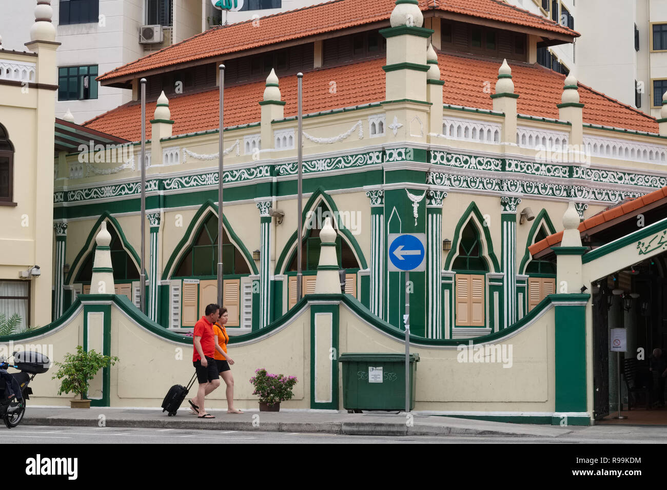 Passers-by in front of Khadijah Mosque in Geylang area, Singapore, Geylang being notorious for its lanes filled with brothels and roadside prostitutes Stock Photo