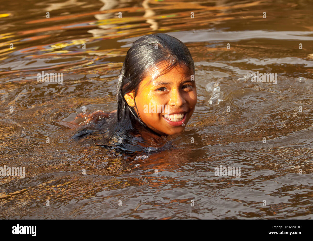 Smiling little girl swimming in Belen's foggy water Stock Photo Alamy
