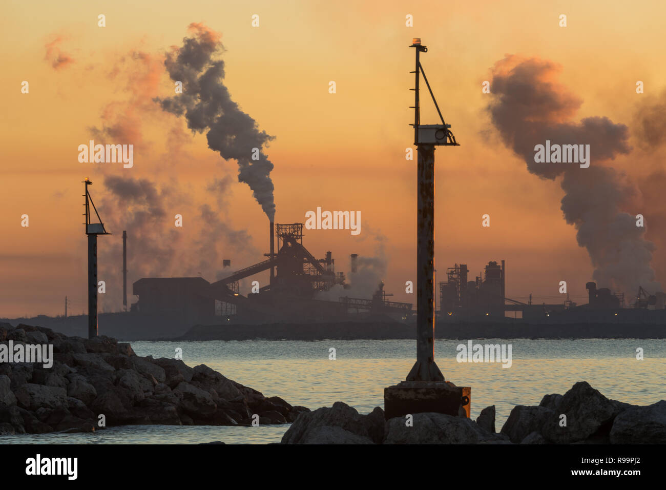 Steel mills of East Chicago, Indiana in early morning light, viewed from the Lake Michigan boat launch in Whiting Park. Stock Photo