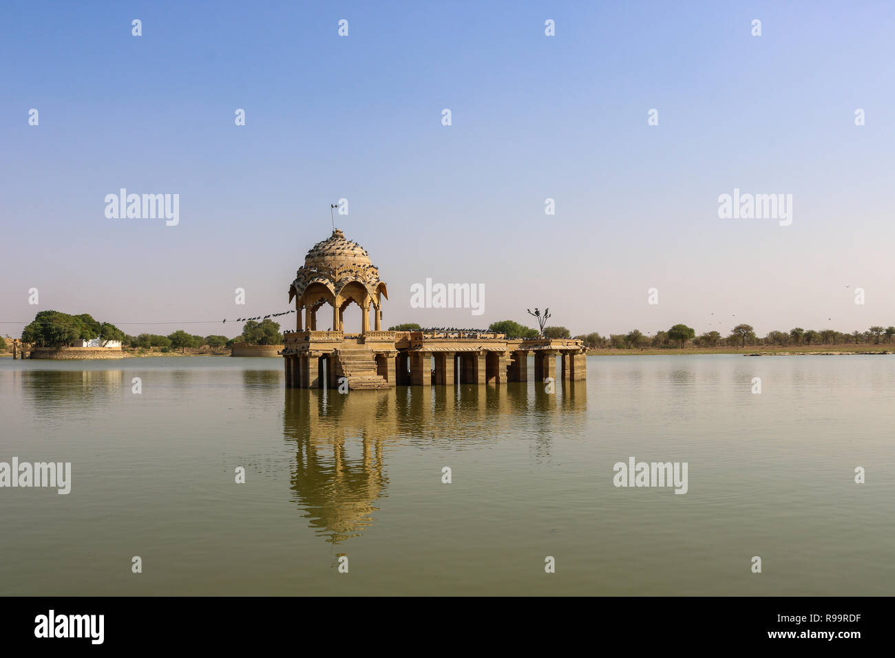 A Temple in the middle of Lake. A man-made water reservoir (Gadisar Lake) in Jaisalmer. Constructed by the first ruler of Jaisalmer, Raja Rawal Jaisal Stock Photo