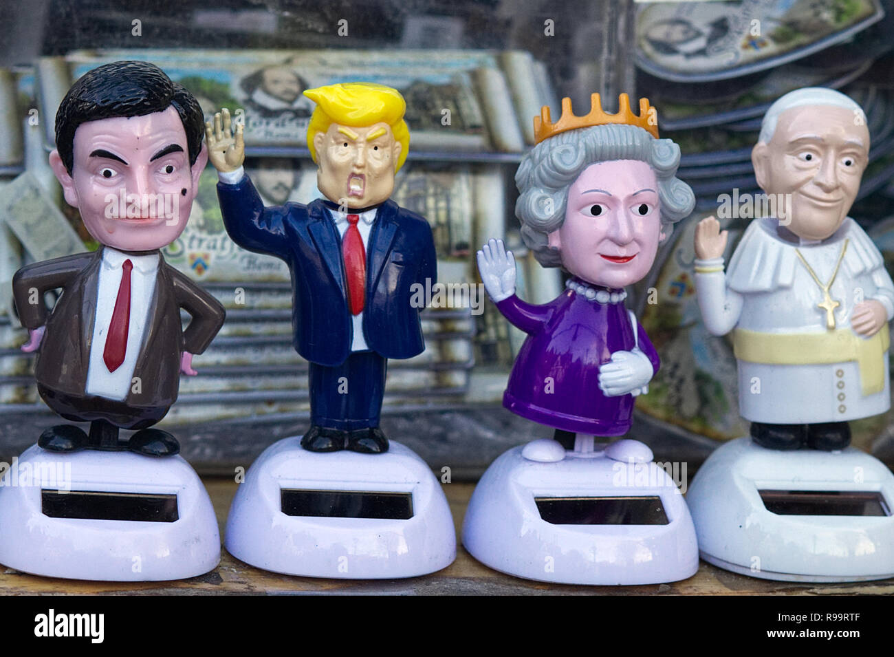 Mr bean, Donald Trump, The Queen and the Pope Solar toys in a shop window in Windsor Stock Photo