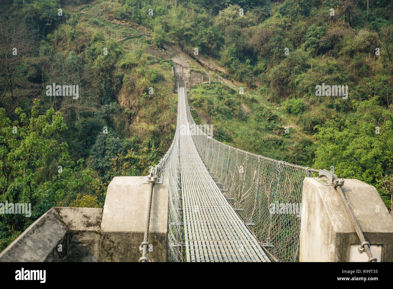 Suspension bridge in Himalayas Stock Photo - Alamy