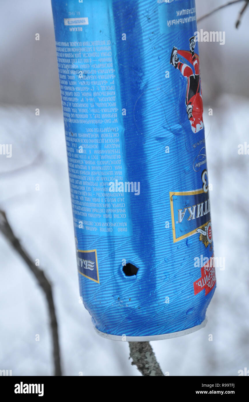 Martynkovo, Ivanovo region, Russia. 29 December 2013. Village Martynkovo. Empty beer can used as a target for shooting firearms with bullet hole Stock Photo