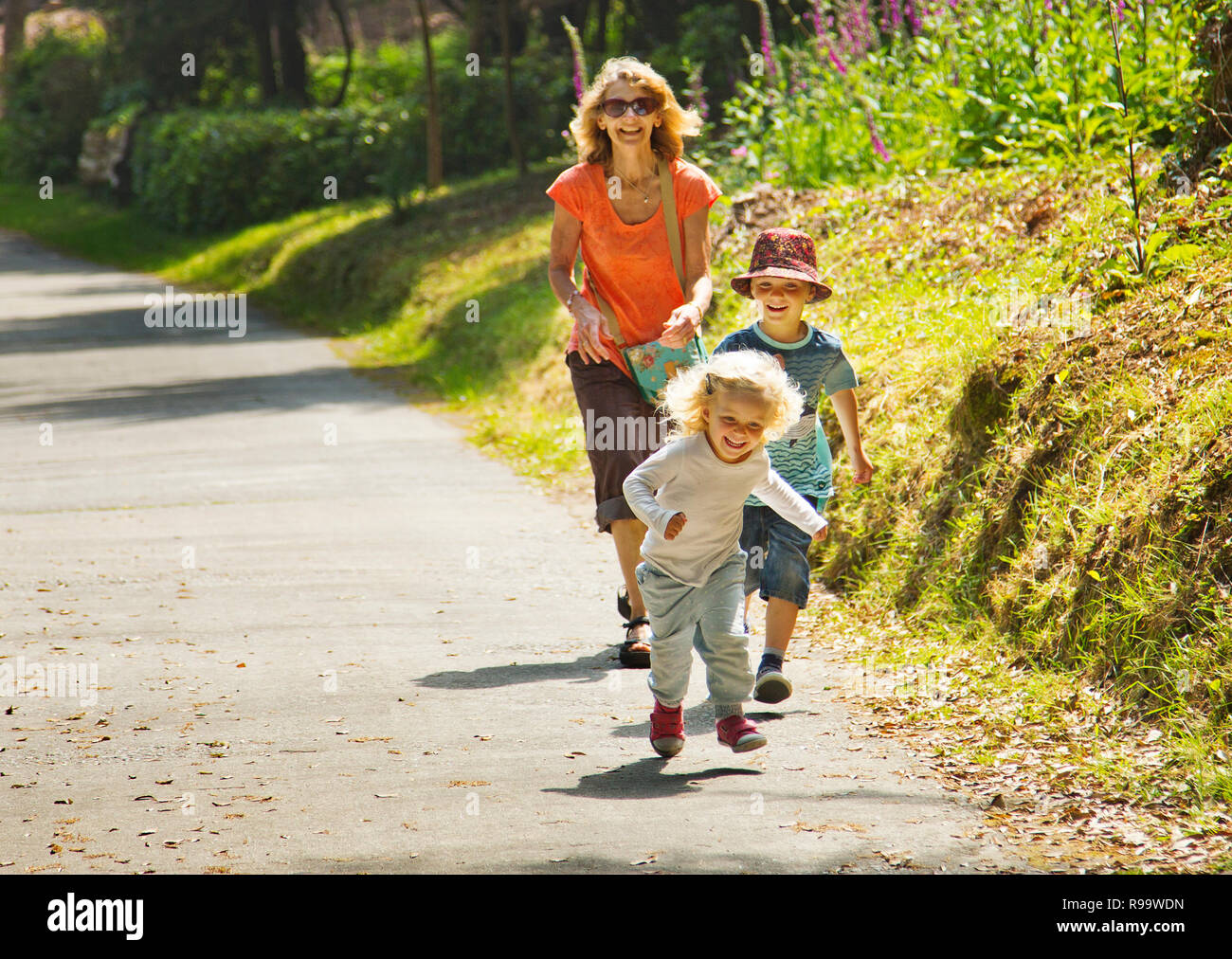 A young looking grandmother playing with her Grandchildren Stock Photo