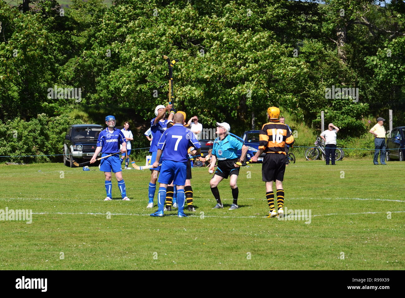 FORT WILLIAM, SCOTLAND - JULY 20: Men playing typical scottish team game shinty with sticks and ball on 20 July 2013 in Fort William, Scotland, United Stock Photo