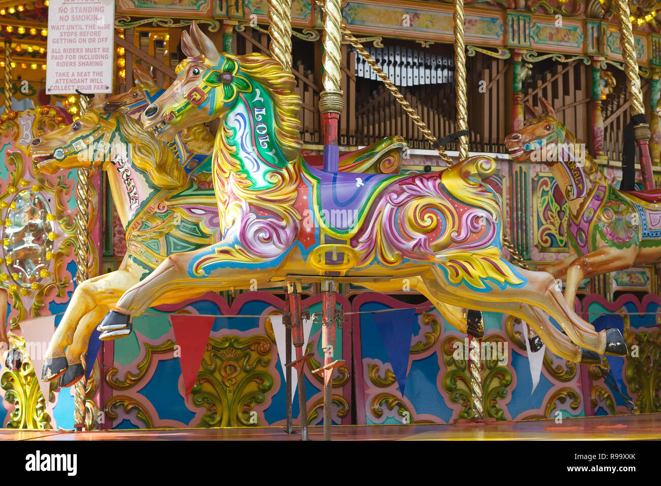 vintage galloping horses on a fairground Stock Photo