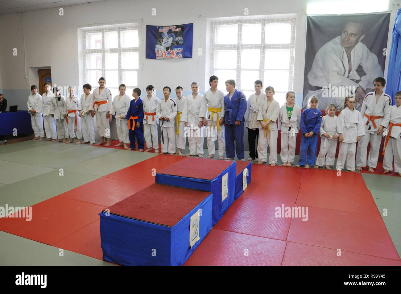 Kovrov, Russia. 26 April 2014. Competitions Judo in sports complex Vympel. Competitors lined up for the awarding ceremony. Portrait of President Vladi Stock Photo