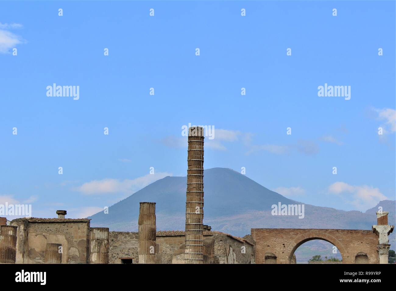 Ruins of the ancient Roman city of Pompeii, Italy, with the Mount Vesuvius volcano that destroyed it in the background. Stock Photo