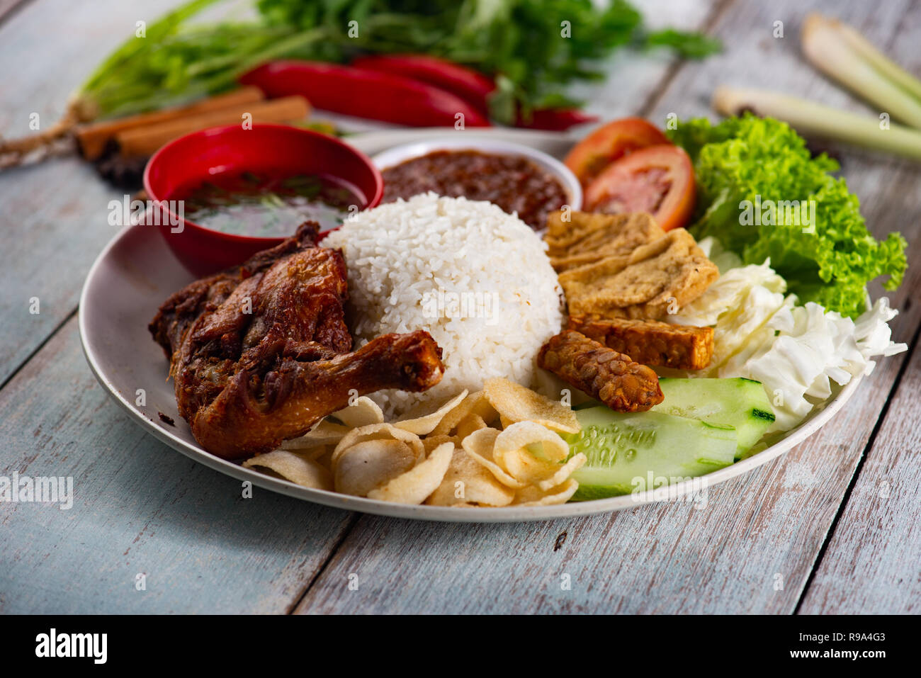 Nasi Campur Ayam Betutu. Stock Photo
