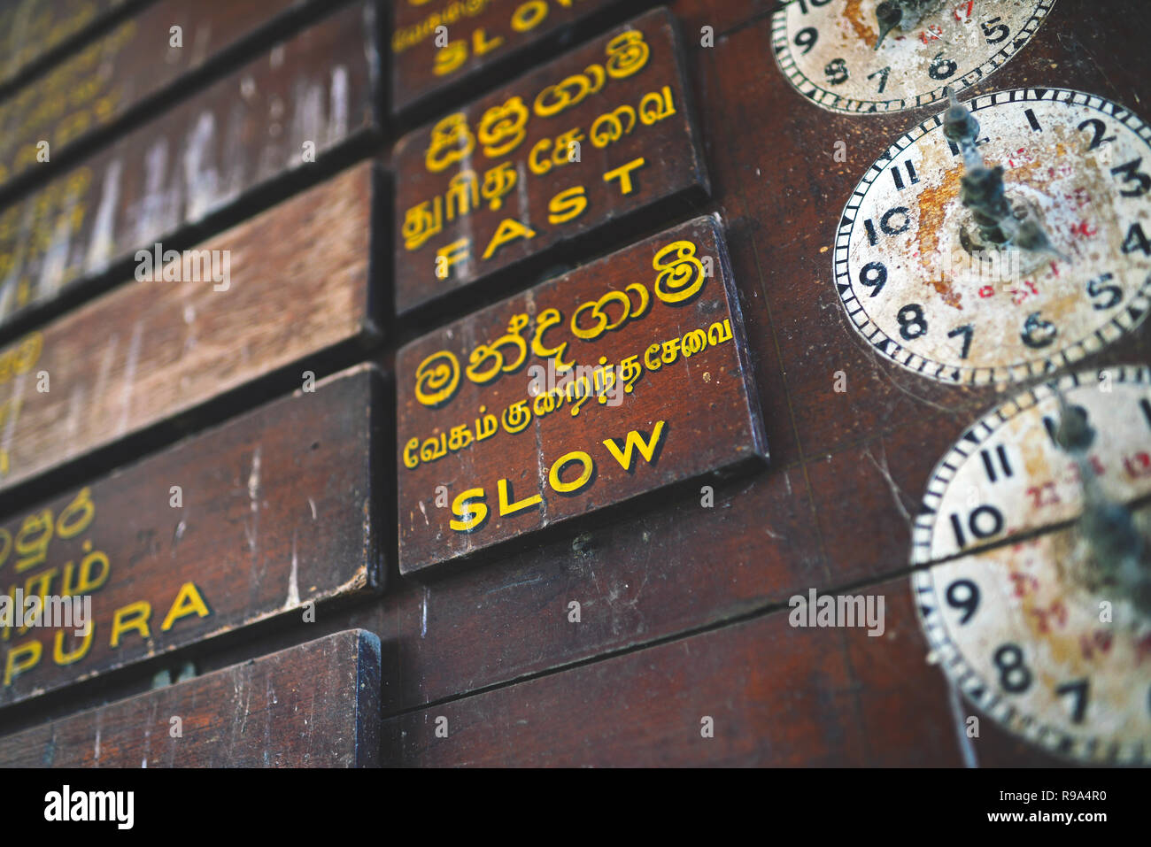 Old wooden clocks and time schedules in train station, Sri Lanka Stock