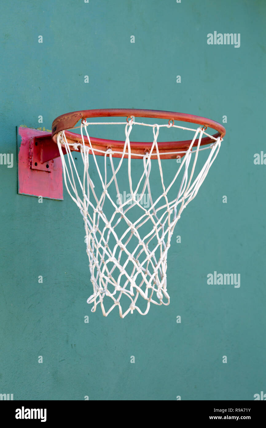 basketball ring on a stone turquoise wall close-up Stock Photo