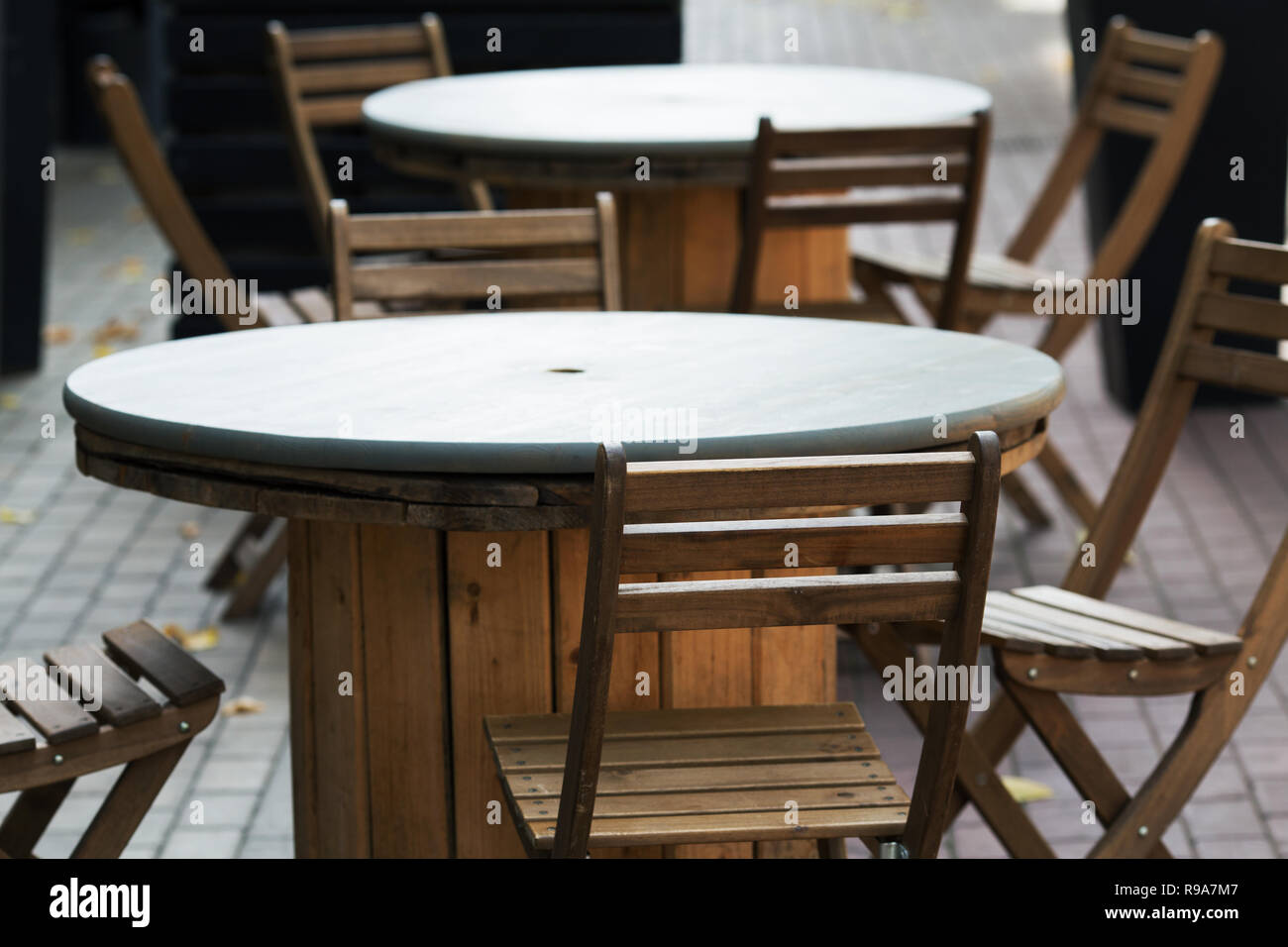 wooden chairs close-up in a street cafe Stock Photo