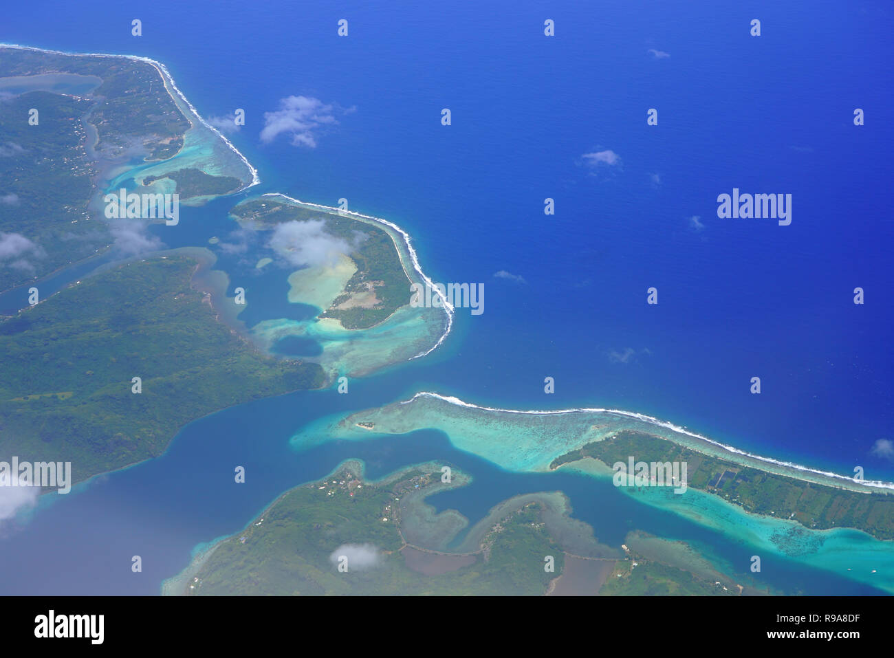 Aerial view of the island and lagoon of Huahine near Tahiti in French Polynesia, South Pacific Stock Photo