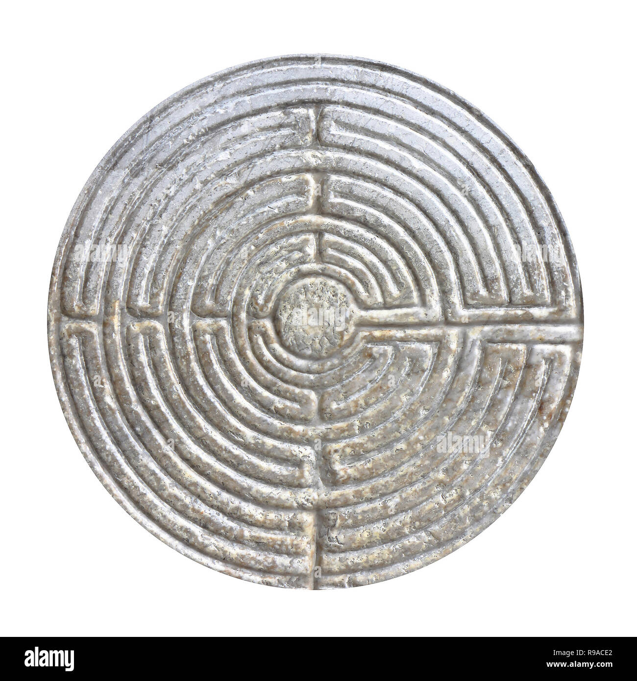 Labyrinth carved on the facade of a Romanesque church of the 11th century - Image on white background for easy selection Stock Photo