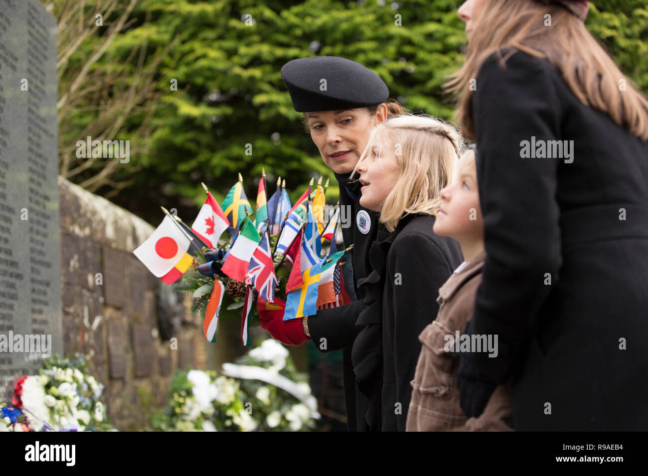 Lockerbie, Scotland, UK. 21st December, 2018. Victoria Cummock (with wreath) and relatives whos husband John died on the Pan Am flight 103. ockerbie Bombing 30th anniversary wreath laying in the Garden of Remembrance at Dryfesdale Cemetery, Lockerbie, Scotland, UK Credit: Allan Devlin/Alamy Live News Stock Photo