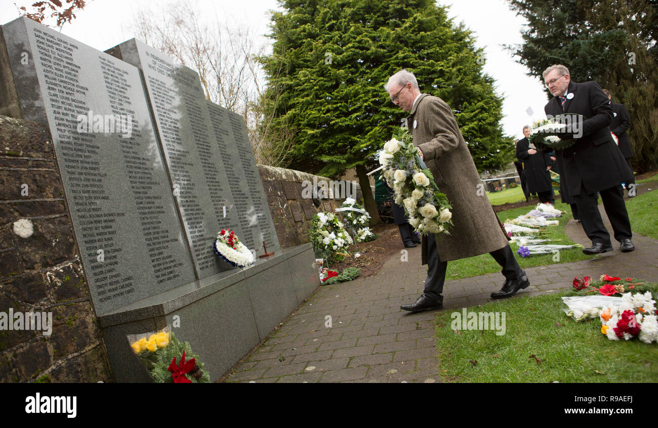 Lockerbie, Scotland, UK. 21st December, 2018. James Wolffe QC and David Mundell, Secretary of State for Scotland. Lockerbie Bombing 30th anniversary wreath laying in the Garden of Remembrance at Dryfesdale Cemetery, Lockerbie, Scotland, UK Credit: Allan Devlin/Alamy Live News Stock Photo
