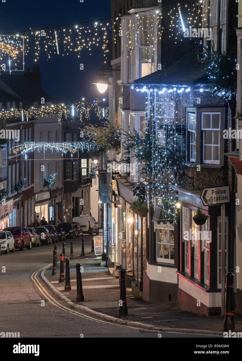 Lyme Regis, Dorset, UK. 21st December 2018. UK Weather: Christmas lights sparkle at dusk on a mild evening at the picturesque coastal town of Lyme Regis on the shortest day of the year.  Credit: DWR/Alamy Live News Stock Photo