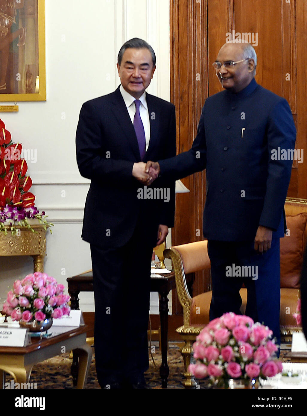 (New Delhi, India. 21st December 2018. Indian President Ram Nath Kovind (R) meets with visiting Chinese State Councilor and Foreign Minister Wang Yi in New Delhi, India, Dec. 21, 2018. China and India pledged here Friday to further boost the people to people exchanges to consolidate public opinion foundation for the development of bilateral relations. (Xinhua/Zhang Naijie) Credit: Xinhua/Alamy Live News Stock Photo
