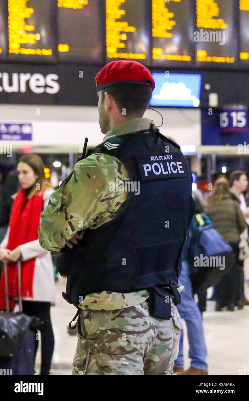 London, UK, 21st December 2018. A Military Police Officer is seen at London Waterloo Station as the annual festive Christmas getaway begins. Credit: SOPA Images Limited/Alamy Live News Stock Photo