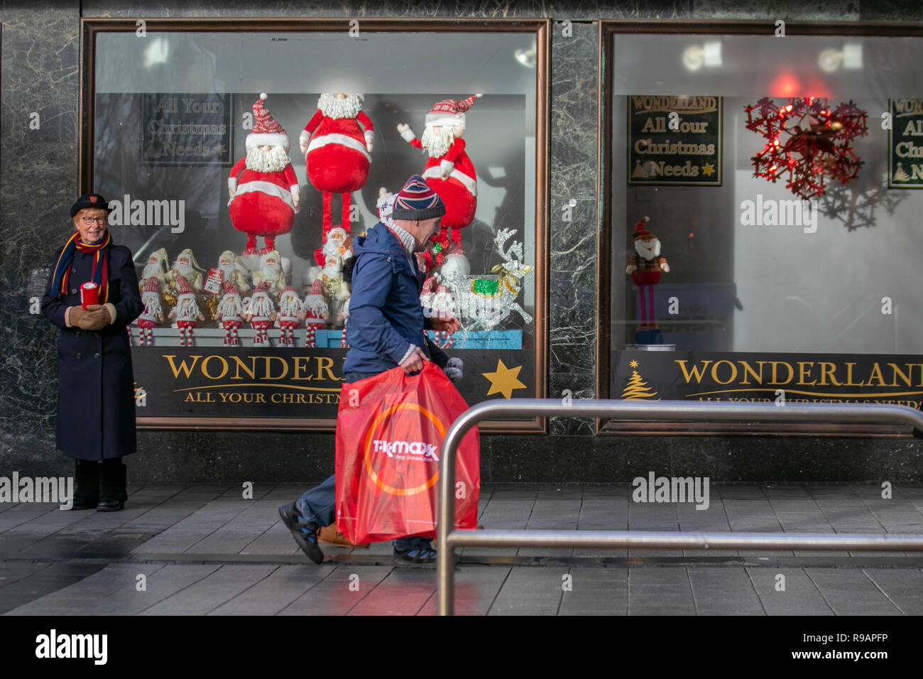 Southport, Merseyside, UK.  22nd Dec, 2018. Salvation Army volunteer and TK Maxx Christmas shopper passing Womde4rland store in the town centre. Credit: MediaWorldImages/Alamy Live News Stock Photo