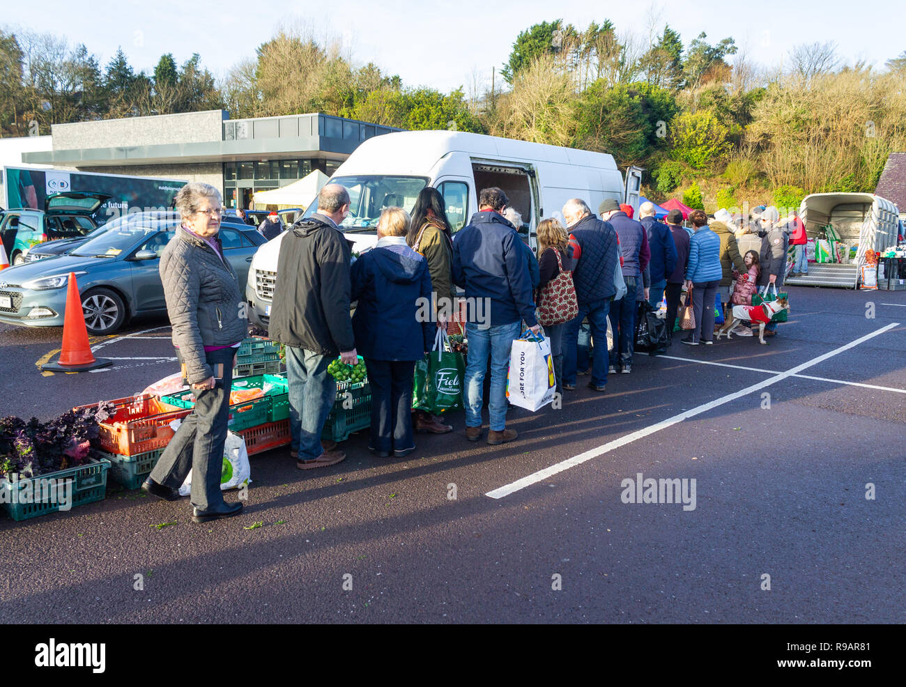Skibbereen, West Cork, Ireland, December 22nd 2018. A fine sunny day helped the shoppers queue to get the freshest sprouts from the farmers market. Credit: aphperspective/Alamy Live News Stock Photo