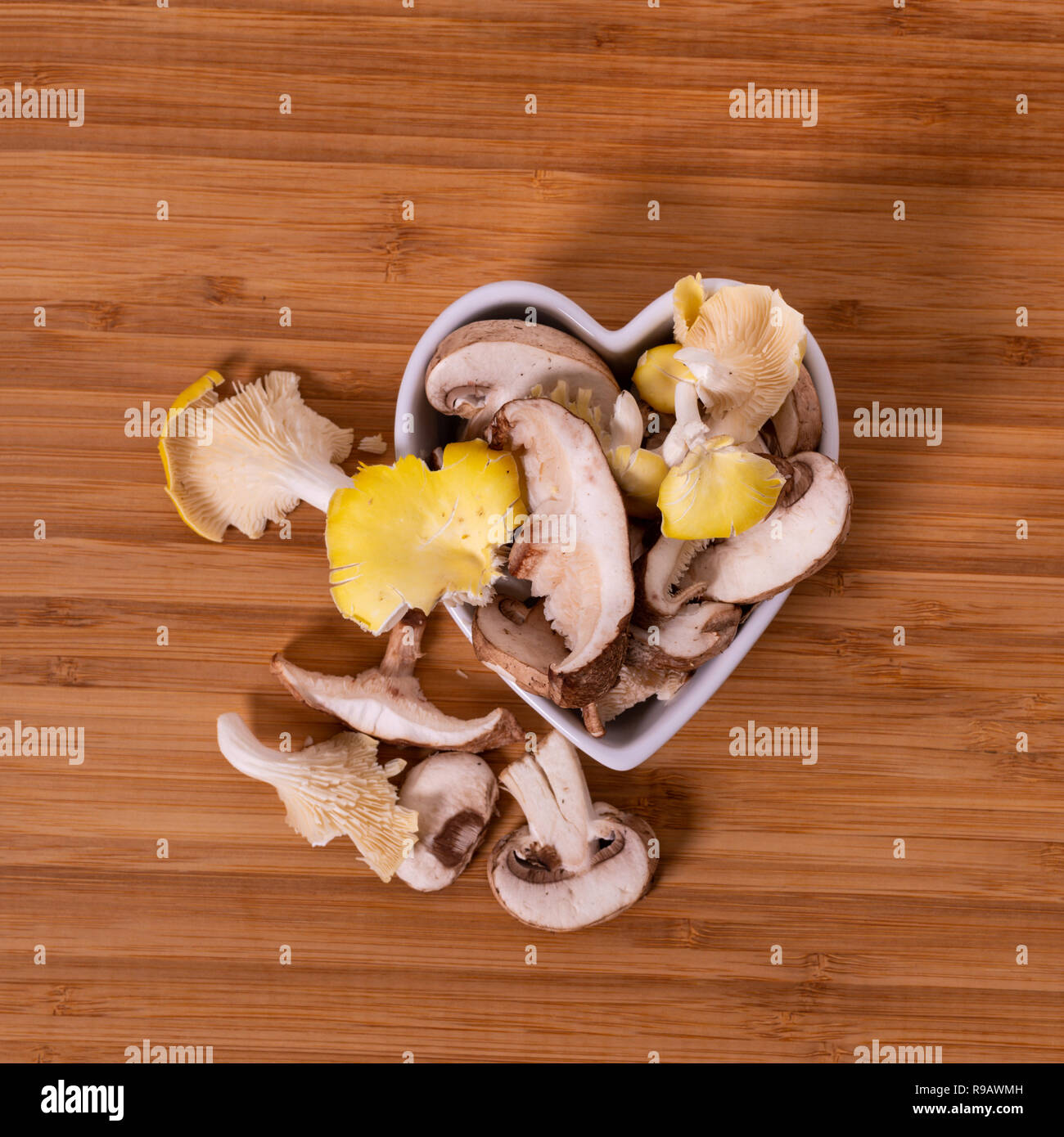 Variety of mixed exotic mushrooms on a cutting board Stock Photo - Alamy